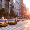 a street view of a city with people and cars