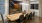 a clubhouse room table with chairs around it