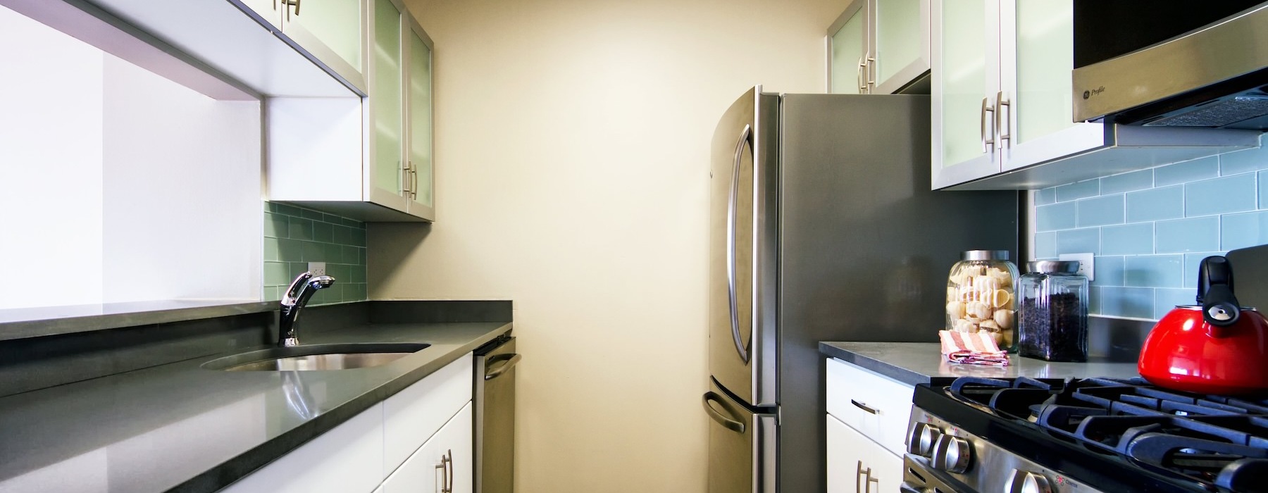 a kitchen with white cabinets