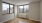 a room with windows and a wood floor