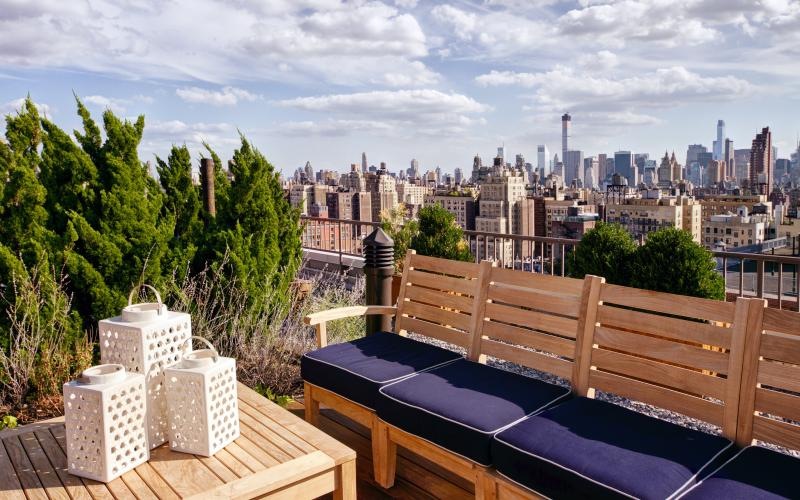 a deck overlooking a city with a couch